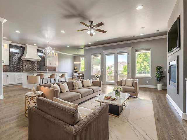 832 Gateway Bridge Rd, Edmond, OK 73034 - living area featuring healthy amount of natural light, recessed lighting, ornamental molding, a chandelier, and ceiling fan