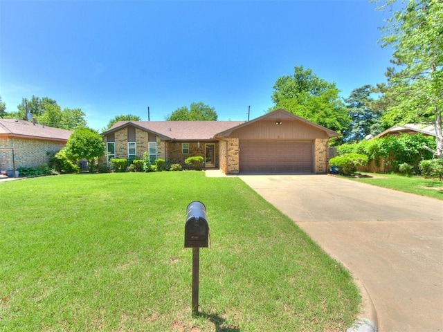 view of front of home with a garage, driveway, and brick siding