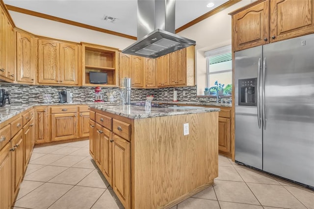 28256 N County Road 3210th Rd, Wynnewood, OK 73098 - kitchen with stainless steel refrigerator with ice dispenser, island exhaust hood, light tile patterned floors, crown molding, and a kitchen island