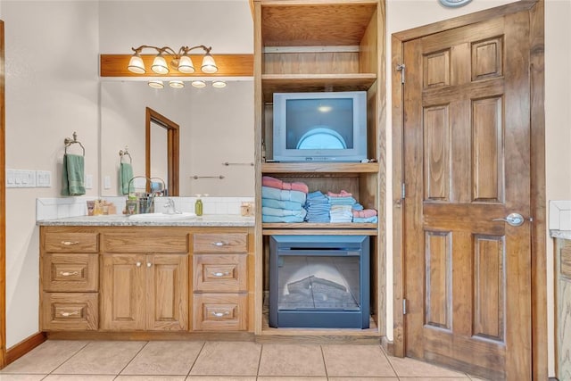 28256 N County Road 3210th Rd, Wynnewood, OK 73098 - bathroom with tile patterned flooring, vanity, and baseboards