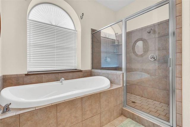 28256 N County Road 3210th Rd, Wynnewood, OK 73098 - full bath featuring a stall shower, a garden tub, and healthy amount of natural light