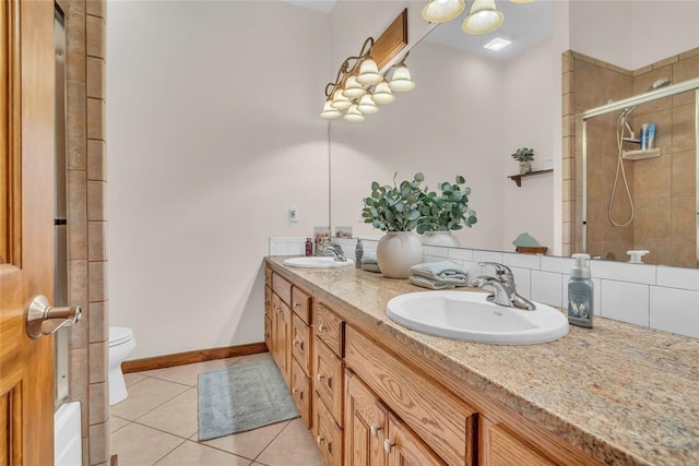 28256 N County Road 3210th Rd, Wynnewood, OK 73098 - full bath featuring tile patterned floors, a tile shower, double vanity, toilet, and baseboards