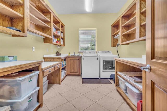 28256 N County Road 3210th Rd, Wynnewood, OK 73098 - washroom with washing machine and dryer, cabinet space, and light tile patterned floors