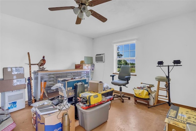 28256 N County Road 3210th Rd, Wynnewood, OK 73098 - misc room with concrete floors, a ceiling fan, a wall mounted air conditioner, a desk, and baseboards