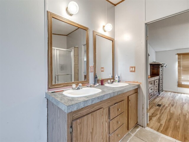 11550 Timber Trl, Lexington, OK 73051 - bathroom with a stall shower, double vanity, and crown molding