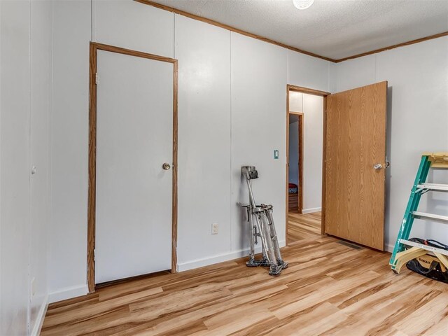 11550 Timber Trl, Lexington, OK 73051 - unfurnished bedroom with wood finished floors and ornamental molding