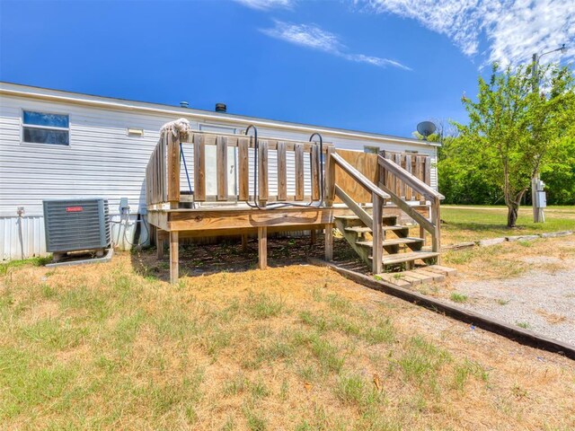 11550 Timber Trl, Lexington, OK 73051 - back of house featuring central AC unit, a wooden deck, and stairway