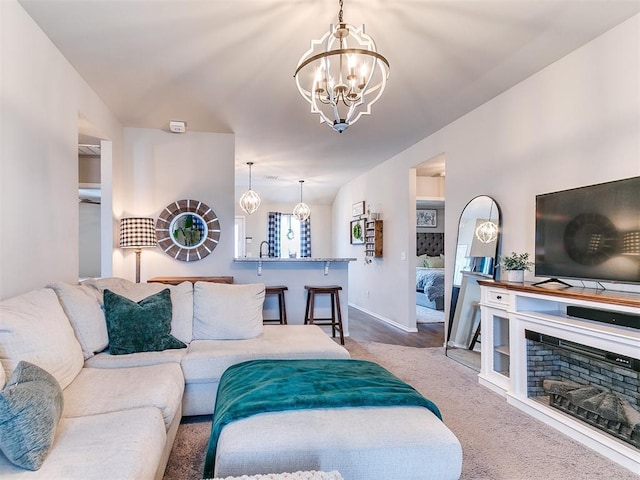 11704 NW 99th Ter, Yukon, OK 73099 - carpeted living room with a chandelier