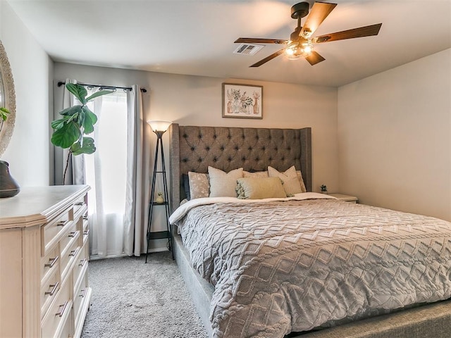 11704 NW 99th Ter, Yukon, OK 73099 - bedroom with light colored carpet and a ceiling fan