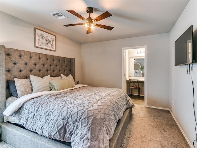 11704 NW 99th Ter, Yukon, OK 73099 - bedroom featuring carpet flooring, ensuite bathroom, a ceiling fan, and baseboards