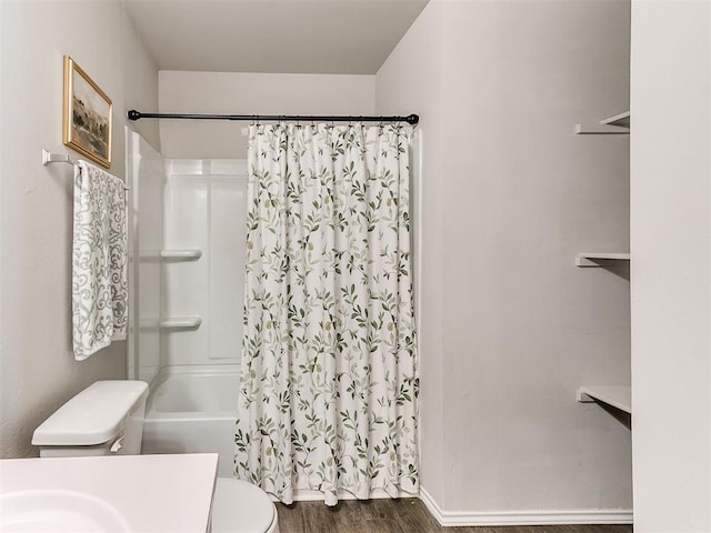 11704 NW 99th Ter, Yukon, OK 73099 - full bath with toilet, wood finished floors, and shower / bath combo