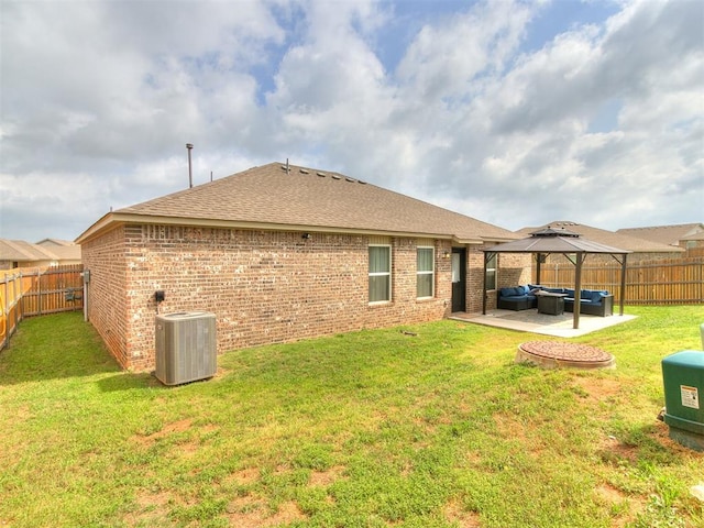 11704 NW 99th Ter, Yukon, OK 73099 - rear view of property with an outdoor living space, central AC, a gazebo, brick siding, and a patio