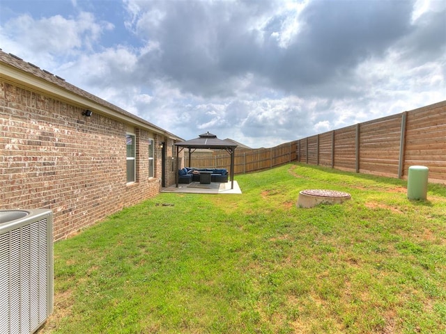 11704 NW 99th Ter, Yukon, OK 73099 - view of yard featuring a gazebo, central AC unit, outdoor lounge area, and a patio