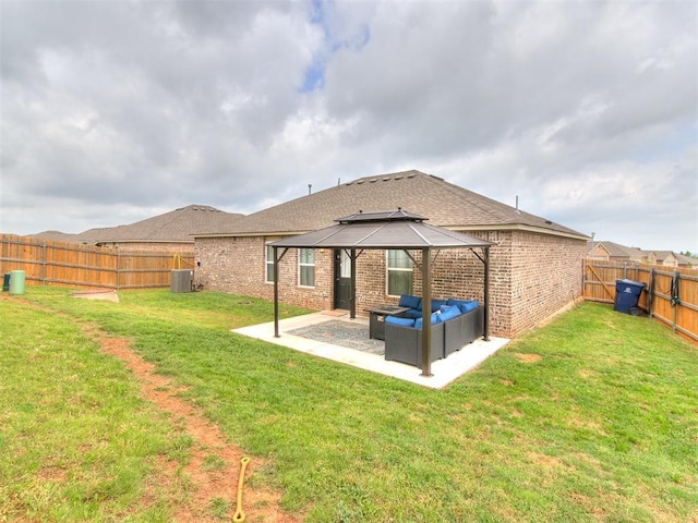 11704 NW 99th Ter, Yukon, OK 73099 - rear view of property with a gazebo, an outdoor living space, a patio area, and brick siding