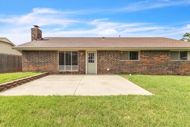 708 Cross Timbers Dr, Moore, OK 73160 - rear view of house with a chimney, brick siding, and a patio