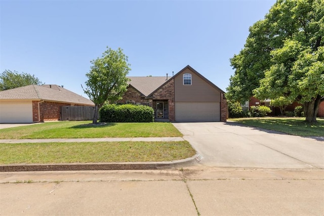 316 SE 6th St, Moore, OK 73160 - traditional home featuring brick siding, driveway, and a garage