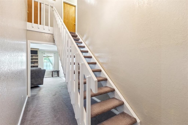 316 SE 6th St, Moore, OK 73160 - stairway with a textured wall, carpet floors, and baseboards