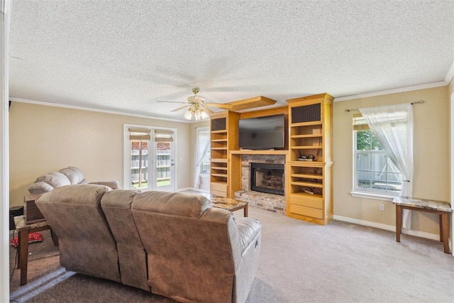 316 SE 6th St, Moore, OK 73160 - carpeted living area featuring ornamental molding, a ceiling fan, a brick fireplace, plenty of natural light, and a textured ceiling