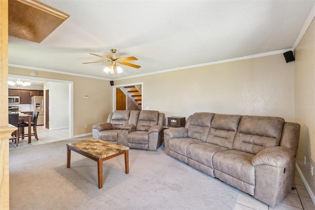 316 SE 6th St, Moore, OK 73160 - living area featuring a ceiling fan, baseboards, ornamental molding, light carpet, and light tile patterned floors