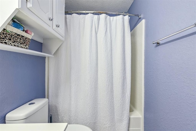316 SE 6th St, Moore, OK 73160 - full bathroom featuring toilet, a textured wall, a textured ceiling, and shower / bath combo