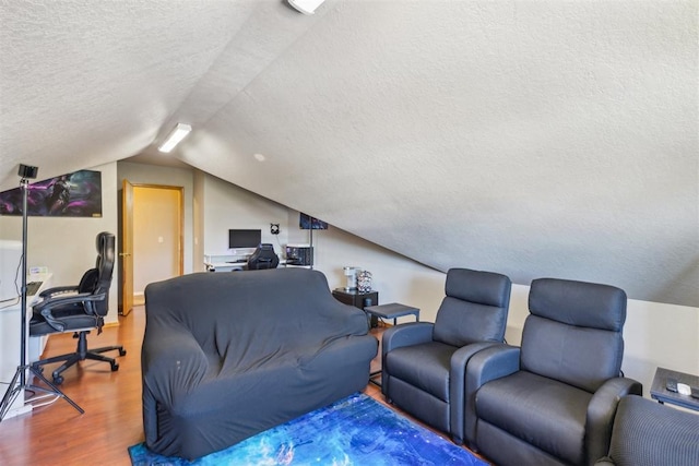 316 SE 6th St, Moore, OK 73160 - living room with a textured ceiling, wood finished floors, an office area, and lofted ceiling