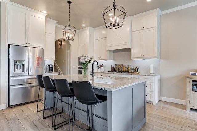12004 SW 49th St, Mustang, OK 73064 - kitchen featuring appliances with stainless steel finishes, a chandelier, baseboards, recessed lighting, and decorative backsplash