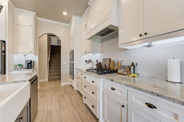 12004 SW 49th St, Mustang, OK 73064 - kitchen featuring appliances with stainless steel finishes, white cabinetry, backsplash, crown molding, and recessed lighting