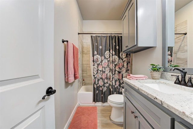 12004 SW 49th St, Mustang, OK 73064 - full bath featuring toilet, vanity, shower / bathtub combination with curtain, and wood finished floors