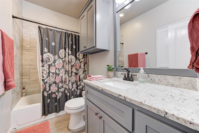12004 SW 49th St, Mustang, OK 73064 - full bath featuring toilet, vanity, shower / tub combo, and wood finished floors