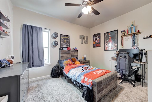 12004 SW 49th St, Mustang, OK 73064 - bedroom featuring light carpet, baseboards, a ceiling fan, and a desk