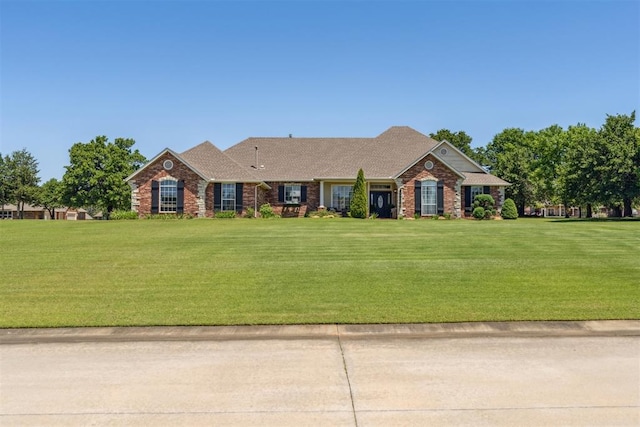 16523 Roserock Cir, Choctaw, OK 73020 - ranch-style home featuring a front lawn and brick siding