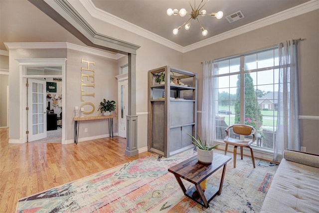 16523 Roserock Cir, Choctaw, OK 73020 - living area featuring a chandelier, wood finished floors, and crown molding