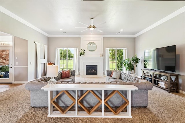 16523 Roserock Cir, Choctaw, OK 73020 - carpeted living room with plenty of natural light, a fireplace, ceiling fan, recessed lighting, and ornamental molding