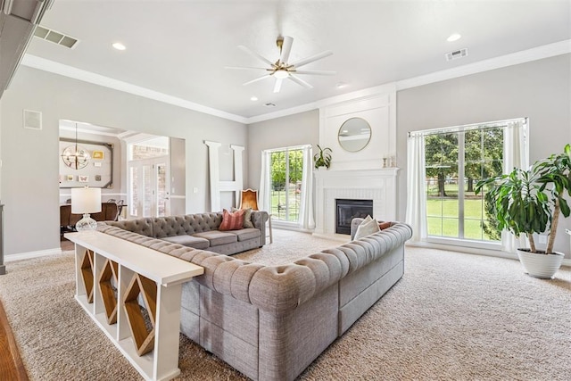 16523 Roserock Cir, Choctaw, OK 73020 - living area with a fireplace, a ceiling fan, a chandelier, ornamental molding, and recessed lighting