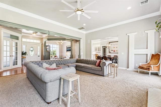 16523 Roserock Cir, Choctaw, OK 73020 - carpeted living room with a chandelier, crown molding, french doors, ceiling fan, and recessed lighting