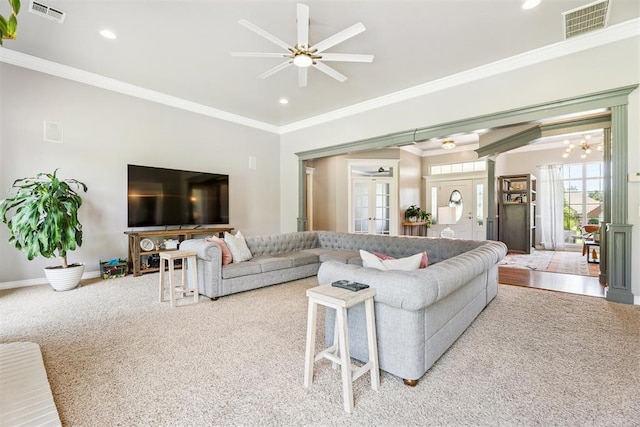16523 Roserock Cir, Choctaw, OK 73020 - carpeted living room featuring recessed lighting, crown molding, a ceiling fan, and a chandelier