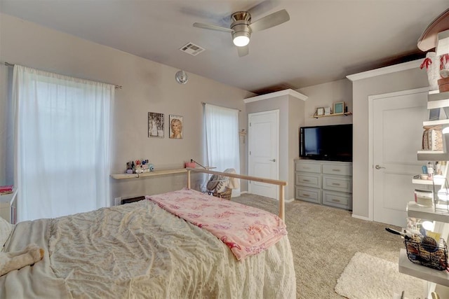 16523 Roserock Cir, Choctaw, OK 73020 - carpeted bedroom with multiple windows and a ceiling fan