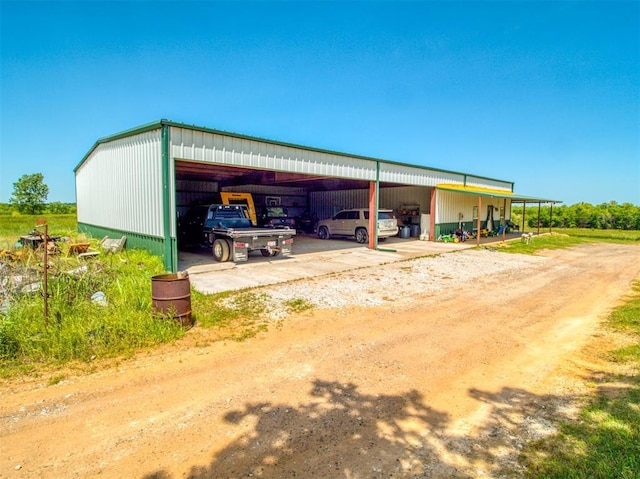 34325 E 1070th Rd, Mcloud, OK 74851 - view of pole building featuring driveway