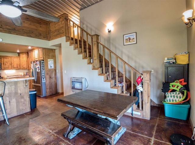 34325 E 1070th Rd, Mcloud, OK 74851 - dining space with stairway, heating unit, ceiling fan, a high ceiling, and concrete flooring