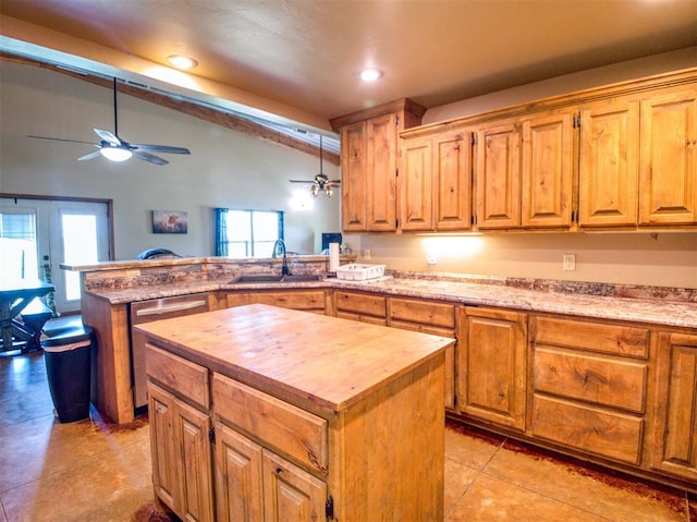 34325 E 1070th Rd, Mcloud, OK 74851 - kitchen with a sink, butcher block counters, dishwasher, vaulted ceiling, and a peninsula