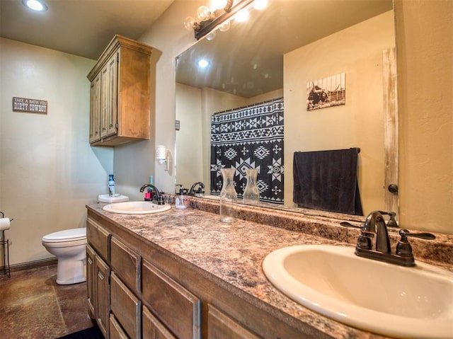 34325 E 1070th Rd, Mcloud, OK 74851 - bathroom featuring toilet, double vanity, and recessed lighting