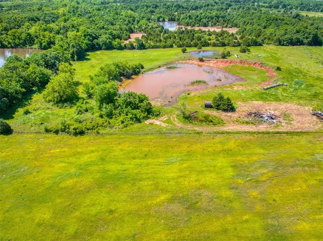 34325 E 1070th Rd, Mcloud, OK 74851 - drone / aerial view of a nearby body of water and a heavily wooded area