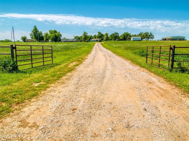34325 E 1070th Rd, Mcloud, OK 74851 - view of dirt / gravel driveway with a rural view and a gated entry