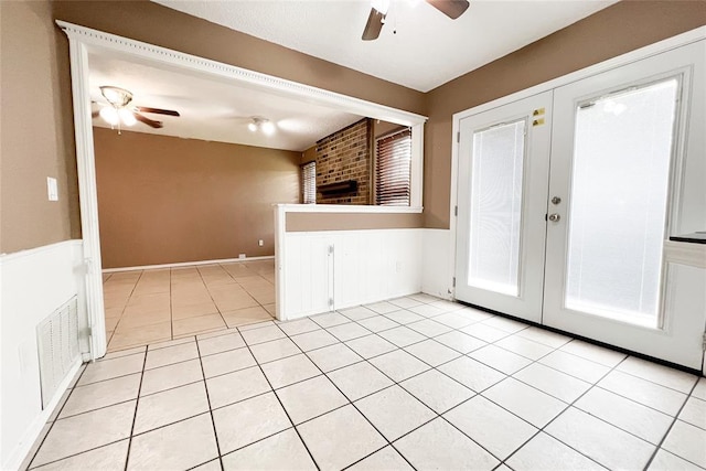 8409 Bigwood Dr, Oklahoma City, OK 73135 - empty room featuring a ceiling fan, french doors, and light tile patterned flooring