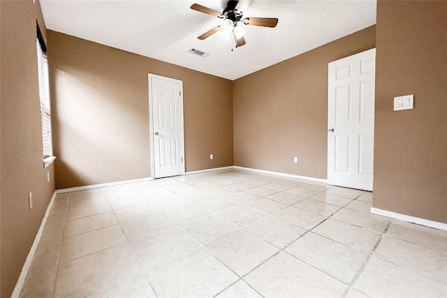 8409 Bigwood Dr, Oklahoma City, OK 73135 - spare room with ceiling fan, light tile patterned flooring, and baseboards