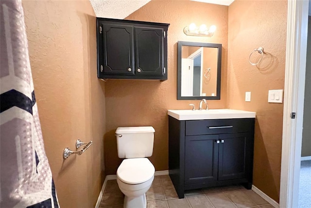 8409 Bigwood Dr, Oklahoma City, OK 73135 - bathroom with tile patterned flooring, a textured wall, toilet, vanity, and baseboards