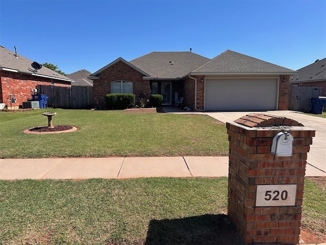 520 E Juniper Ln, Mustang, OK 73064 - ranch-style home with brick siding, driveway, a garage, cooling unit, and a shingled roof