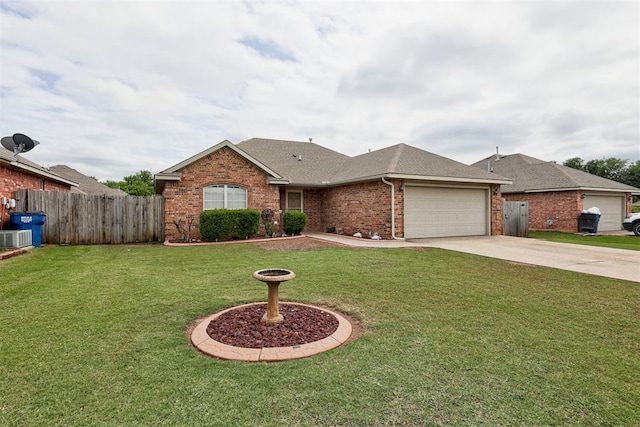 520 E Juniper Ln, Mustang, OK 73064 - view of front facade featuring brick siding, a garage, roof with shingles, and driveway