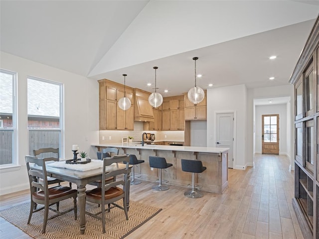 7909 NW 162nd St, Edmond, OK 73013 - dining space with light wood-style flooring, recessed lighting, baseboards, and vaulted ceiling