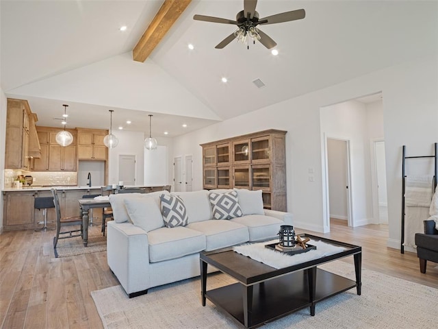 7909 NW 162nd St, Edmond, OK 73013 - living room featuring beamed ceiling, light wood-style flooring, recessed lighting, ceiling fan, and high vaulted ceiling